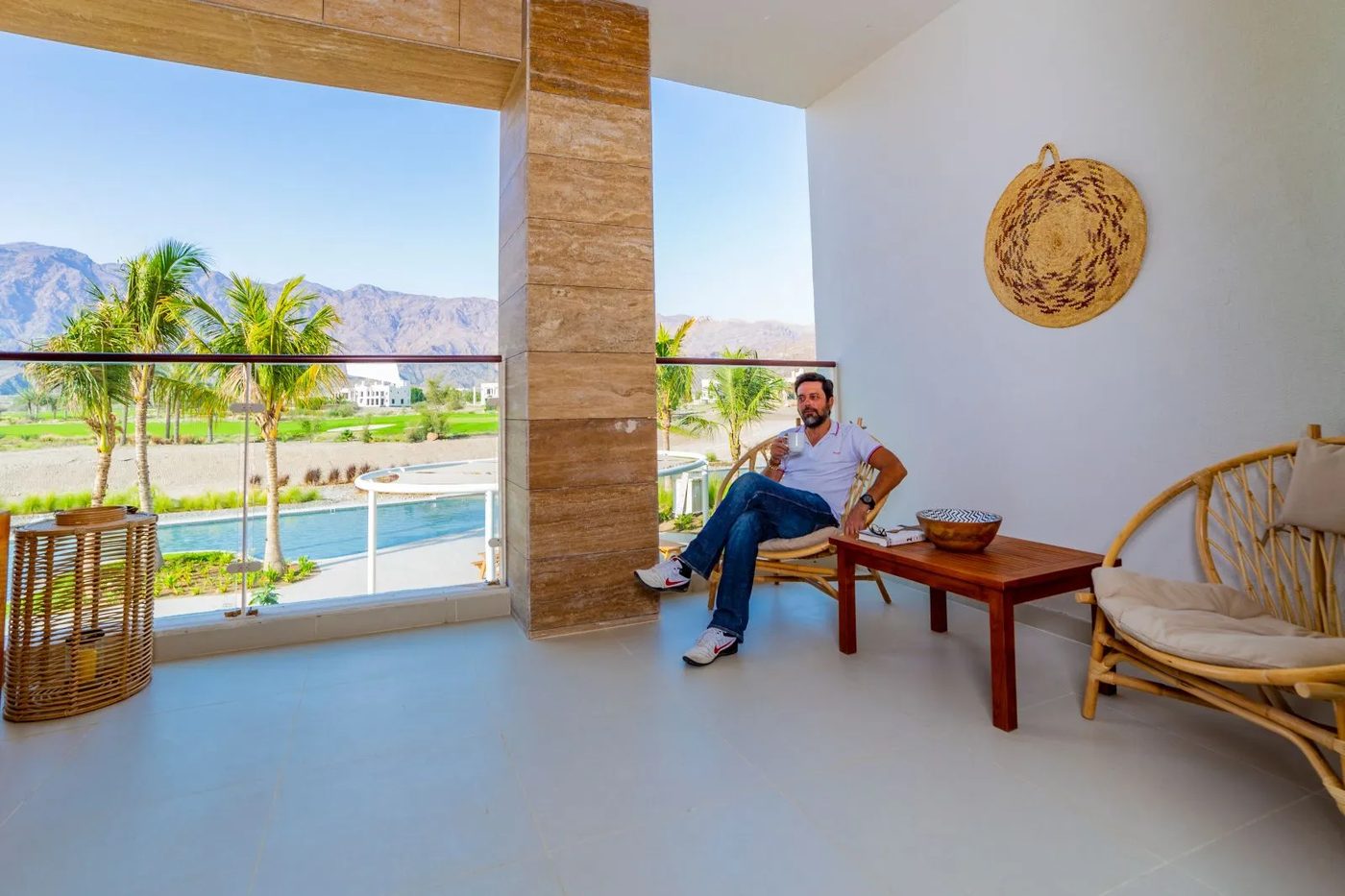 Jebel Sifah — balcony with pool and mountain views